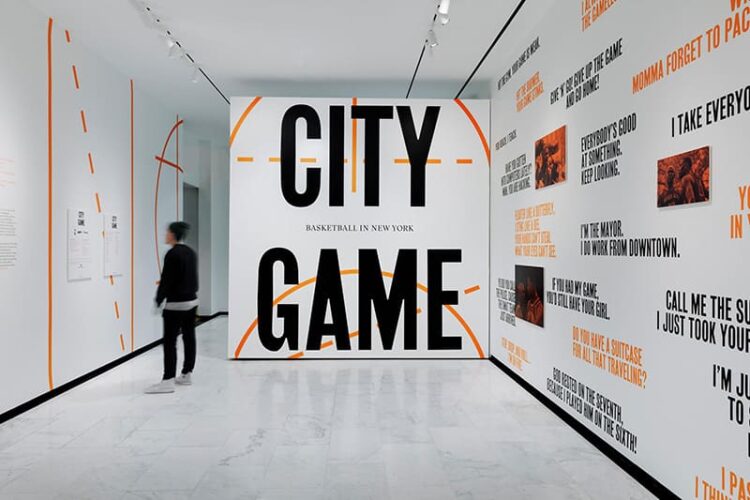 Basketball exhibition with text featuring "City Game"
